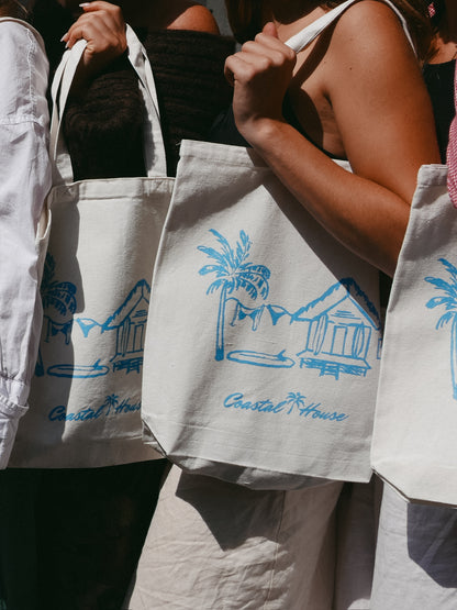 girl holding beach tote bag